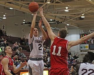 Boardman's Gannon Murray (2) goes up for a shot while being defended by Austintown Fitch's Anthony Pangio (11) during the first quarter of Friday nights matchup at Boardman High School.  Dustin Livesay  |  The Vindicator  2/19/16  Boardman High School.