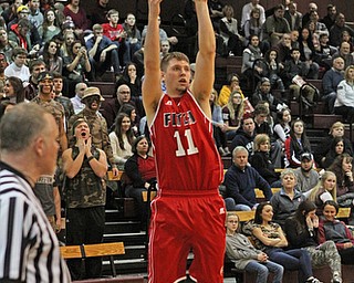 Austintown Fitch's Anthony Pangio (11) attempts an open 3-pointer during the second quarter of Friday nights matchup against Boardman at Boardman High School.  Dustin Livesay  |  The Vindicator  2/19/16  Boardman High School.