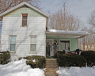      ROBERT K. YOSAY  | THE VINDICATOR..Ed Runyan explains the water lead  results to Lee Ann Mazza on South Street...--30-...