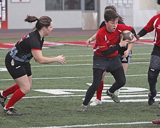 Samantha Phillips of the Youngstown Steel Valley womens rugby team finds a whole in the defense of the Cleveland Iron Maidens during the first round of the 2016 Thomas "Chris" Smythe Tournament at the Watson and Tressel Training Site on Saturday morning. Dustin Livesay  |  The Vindicator  2/20/16  WATTS
