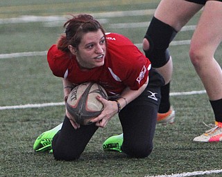 Chrissy Gandy of the Youngstown Steel Valley womens rugby team picks up a loose ball during the first round of the 2016 Thomas "Chris" Smythe Tournament at the Watson and Tressel Training Site on Saturday morning. Dustin Livesay  |  The Vindicator  2/20/16  WATTS