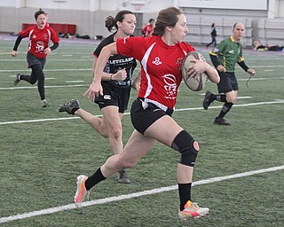 Brigette Ford of the Youngstown Steel Valley womens rugby team outruns Mary Kuhner of the Cleveland Iron Maidens during the first round of the 2016 Thomas "Chris" Smythe Tournament at the Watson and Tressel Training Site on Saturday morning. Dustin Livesay  |  The Vindicator  2/20/16  WATTS