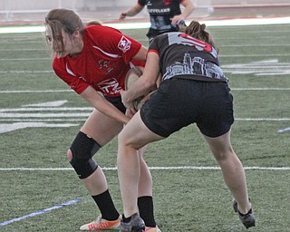 Brigitte Ford of the Youngstown Steel Valley womens rugby team holds on to the ball while being tackled by Mary Kuhner (9) of the Cleveland Iron Maidens during the first round of the 2016 Thomas "Chris" Smythe Tournament at the Watson and Tressel Training Site on Saturday morning. Dustin Livesay  |  The Vindicator  2/20/16  WATTS