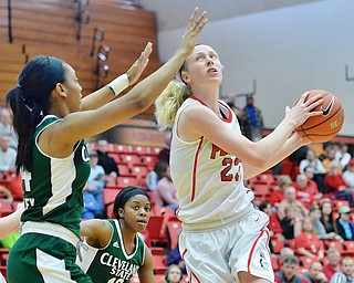 Jeff Lange | The Vindicator  SAT, FEB 20, 2016 - Youngstown's Sarah Cash (right) looks to the hoop for a layup over Cleveland's Shadae Bosley (left) in the first half of their basketball game in Youngstown Saturday.