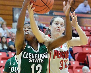 Jeff Lange | The Vindicator  SAT, FEB 20, 2016 - Vikings' Brooke Smith (12) and Youngstown's Jenna Hirsch (32) fight for a rebound in the first half of their basketball game in Youngstown on Saturday.