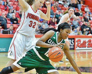 Jeff Lange | The Vindicator  SAT, FEB 20, 2016 - Cleveland State's Brooke Smith falls to the floor as she fights for the ball with YSU's Jenna Hirsch in the first half of Saturday's game in Youngstown.