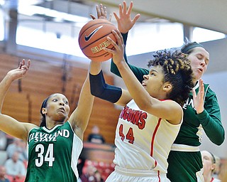 Jeff Lange | The Vindicator  SAT, FEB 20, 2016 - Under the heavy pressure of Cleveland State's Shadae Eckles (34) and Olivia Voskuhl, Penguins' Janae Jackson (44) attempts a two point shot in the first half of Saturday's game in Youngstown.