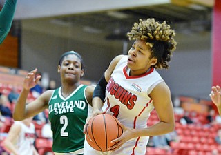 Jeff Lange | The Vindicator  SAT, FEB 20, 2016 - Penguins' Janae Jackson (center) drives to the basket through Cleveland State's Olivia Voskuhl (left), Ashanti Abshaw (2) and Khayla Livingston in the third quarter of Saturday's game in Youngstown.