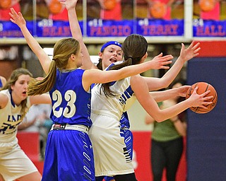 AUSTINTOWN, OHIO - FEBRUARY 22, 2016: Annie Pavlansky #10 of Lakeview is pressured by Emily Melnek #42 and Bella Gajdos #23 of Poland during the 1st half of their game Monday night at Austintown Fitch High School. DAVID DERMER | THE VINDICATOR