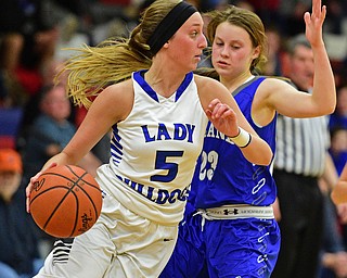 AUSTINTOWN, OHIO - FEBRUARY 22, 2016: Jensen Silbaugh #5 of Lakeview dribbles up court while being tightly pressured by Bella Gajdos #23 of Poland during the 1st half of their game Monday night at Austintown Fitch High School. DAVID DERMER | THE VINDICATOR