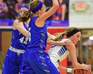 AUSTINTOWN, OHIO - FEBRUARY 22, 2016: Jensen Silbaugh #5 of Lakeview is fouled by Emily Melnek #42 and Sarah Bury #5 of Poland during the 2nd half of their game Monday night at Austintown Fitch High School. DAVID DERMER | THE VINDICATOR