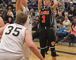 Riko Rodriguez (2) of Mineral Ridge goes up for a shot while being defended by Marc Kraml during the second quarter of Tuesday nights matcup at Brookfield High School.  Dustin Livesay   |   The Vindicator  2/24/16  Brookfield High School.