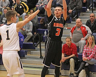 Christian DiRando (3) of Mineral Ridge takes a jump shot while being defended by Brookfield's Chad Filipovich (1) during the third quarter of Tuesday nights matcup at Brookfield High School.  Dustin Livesay   |   The Vindicator  2/24/16  Brookfield High School.