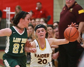 Williaqm D Lewis The Vindicator  SR's Morgan Czopur(20) drives around Ursulines Makayla Berry (21).