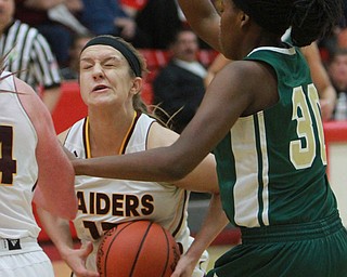 William D Lewis the vindicator  South Range's Maddie Durkin (13) is fould by Ursuline's Anyah Curd(30) during 2-24-16 action at Struthers.