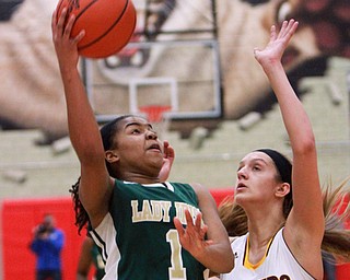 William D Lewis The Vindicator Ursuline's DayshanetteHArris(1) shoots past SR's Maddie Durkin (13)