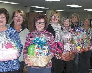 SPECIAL TO THE VINDICATOR | The Austintown Junior Women’s League will host its annual Taste of Austintown fundraiser at 6 p.m. Saturday at Immaculate Heart of Mary social hall, 4490 Norquest Blvd., Austintown. Guests will enjoy food and wine from 18 local vendors as well as dancing and bidding on more than 50 auction items. League members who helped prepare the auction baskets included, from left, AJWL president Kathy Rusback, Marcia Denamen, Ellen Kosa, Marie Dockry, Linda Jones, Paulette Dockry, Colleen Miller, Janie Surman and Janice Simmerman. Proceeds from the event will benefit scholarship recipients of Austintown Fitch High School. For information on the league and event, visit www.facebook.com/ajwl2014.