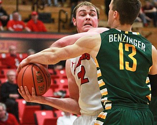 William D Lewis The Vindicator YSU's Joden Kaufman(32) keeps the ball from WSU's  Grant Benzinger(13) during2-25-16 game at YSU