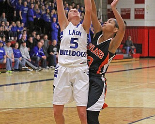 Howland's Amber Rodriguez (13) jumps to defend Lakeview's Jensen Silbaugh (5) during the third quarter of Thursday nights matchup at Austintown Fitch High School.   Dustin Livesay  |  The Vindicator  2/25/16  Austintown.
