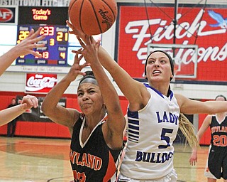 Howland's Amber Rodriguez (13) fights for a loose ball with Lakeview's Jensen Silbaugh (5) during the third quarter of Thursday nights matchup at Austintown Fitch High School.   Dustin Livesay  |  The Vindicator  2/25/16  Austintown.