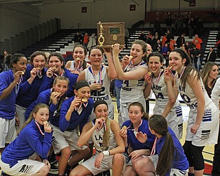 The Lakeview Bulldogs girls basketball team celebrates while holding the championship trophy after the Bulldogs defeated Howland High School to win the District Championship at Austintown Fitch High School on Thursday night.   Dustin Livesay  |  The Vindicator  2/25/16  Austintown.