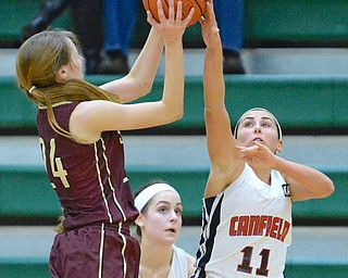 Jeff Lange | The Vindicator  THU, FEB 25, 2016 - Canfield's Ashlet Kaleel (11) blocks the shot of Stow's Lizzie Stefanov (24) late in their Division I district championship game at Akron St. Vincent St. Mary High School Thursday night.