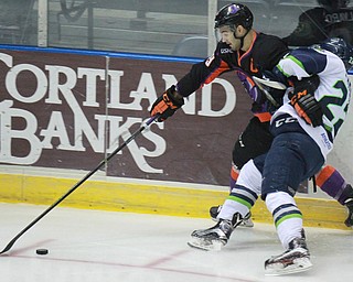William d Lewis the vindicator  Phantoms Matt alvaro(19) keeps puck from thunder's Logan Lambdin (22)