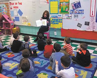 SPECIAL TO THE VINDICATOR | Linda Medwig of Mars, Pa., author of “The Big Sneeze,” recently visited Ursuline Preschool and Kindergarten to read to the students of Lori Shindle’s transitional kindergarten class. The author will also be a guest at USPK’s book fair preview night on March 10.