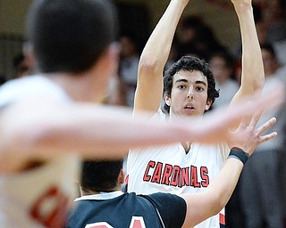 Jeff Lange | The Vindicator  FRI, FEB 26, 2016 - Canfield's Sam Digiacomo looks to make a pass to a teammate in the first half of Friday night's game in Canfield.