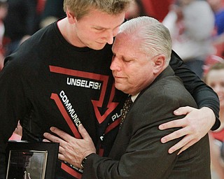 William d Lewis the vindicator YSU's Bobby Hain embraces coach Jerry Slocum before 2-27-16 game. Hain was honored duirng senior night.