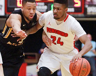 William d Lewis the vindicator  YSU's Cameron Morwe(24) drives around NKU's Tyler white(3).