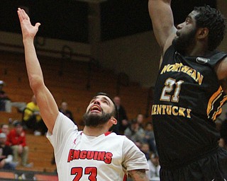 William DLewis The Vindicator  YSU's Francisco Santiago (23) shoots past  NKU's Jalen Billups21).