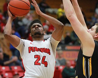 William DLewis The Vindicator  YSU's cameron Morwe(24) shoots past  NKU's Dean Danos(44).