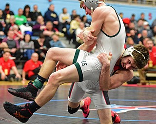 C.J. Frost of Canfield drags down Luke McKeon of Mentor Lake Catholic to the mat during their 138lb Division II championship bout Saturday night at Alliance High School. SPECIAL TO THE VINDICATOR