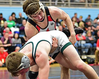 C.J. Frost of Canfield takes down Luke McKeon of Mentor Lake Catholic to the mat during their 138lb Division II championship bout Saturday night at Alliance High School. SPECIAL TO THE VINDICATOR