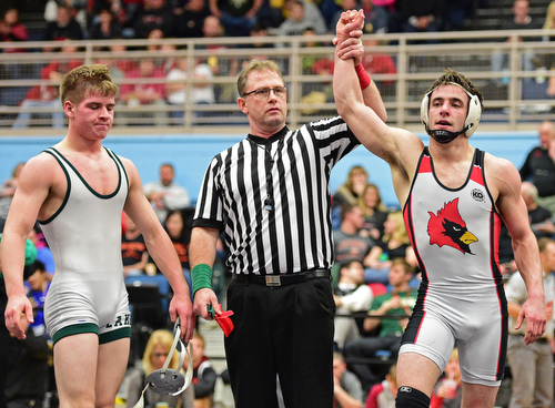 C.J. Frost of Canfield has his arm raised in victory by the referee after defeating Luke McKeon of Mentor Lake Catholic in their 138lb Division II championship bout Saturday night at Alliance High School. SPECIAL TO THE VINDICATOR