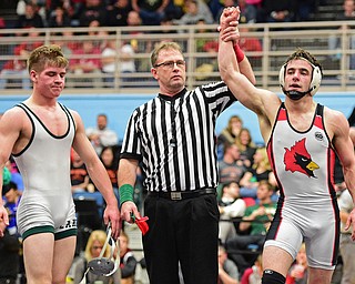 C.J. Frost of Canfield has his arm raised in victory by the referee after defeating Luke McKeon of Mentor Lake Catholic in their 138lb Division II championship bout Saturday night at Alliance High School. SPECIAL TO THE VINDICATOR