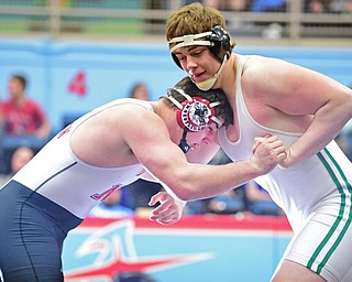 Ian Sharp of West Branch wrestles for position with Mitch Bischoff of Norton during their 285lb Division II championship bout Saturday night at Alliance High School. SPECIAL TO THE VINDICATOR