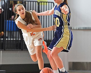 Tori Blandme #5 of Newton Falls passes the ball while being pressured int he corner by Alivia O'Brian #10 of Brookfield during the 1st half of their district final game Saturday afternoon at Ravenna High School. SPECIAL TO THE VINDICATOR