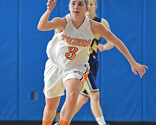 Hanna Harnichar #3 of Newtown Falls chases after a loose ball to grab a long rebound during the 1st half of their district final game Saturday afternoon at Ravenna High School. SPECIAL TO THE VINDICATOR