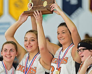 Kayla Barreca #14 and Gabby Kline #21 of Newton Falls raise the district championship trophy after their teams district final victory Saturday afternoon at Ravenna High School. SPECIAL TO THE VINDICATOR..Autumn Hutson #2 and Hanna Harnichar pictured.