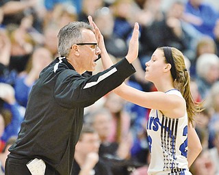 Jeff Lange | The Vindicator  SAT, FEB 27, 2016 - Jackson-Milton head coach Dave Crismon high fives Michaelina Terranova as she comes off the floor in the final moments of the Lady Jays' matchup against McDonald in the DIV district championship Saturday in Mineral Ridge.