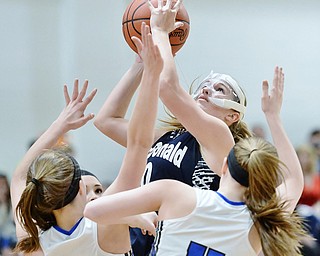 Jeff Lange | The Vindicator  SAT, FEB 27, 2016 - McDonald's Sara Joseph looks to the basket over a host of Jackson-Milton defenders during Saturday's DIV district championship in Mineral Ridge.