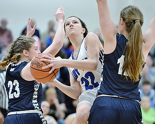 Jeff Lange | The Vindicator  SAT, FEB 27, 2016 - Lady Jays' Michaelina Terranova (22) looks to the basket for two between McDonald's Sierra Welch (23) and Samantha Homa in the second half of their matchup Saturday afternoon in Mineral Ridge.