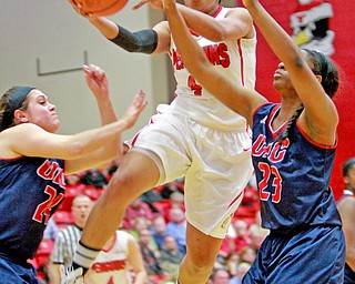 William D. Lewis the vindicator  YSU's Janae Jackson(44) shoots over UIC's Marissa Grossfield (24) and Desiree Jackson(23) during 2-28-16 action at YSU.