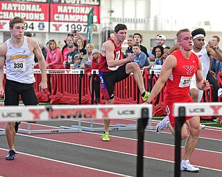 YOUNGSTOWN, OHIO - FEBRUARY 28, 2016: Chad Zallow of Youngstown State leads Nate Pozolinski of Wisconsin-Milwaukee, Ilia Panev of Detroit and Caleb Lloyd of Youngstown State during the 60 meter mens hurdles final Sunday afternoon during the Horizon League Championship meet at the Watts Training Facility. DAVID DERMER | THE VINDICATOR