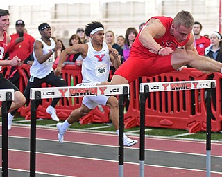 YOUNGSTOWN, OHIO - FEBRUARY 28, 2016: Chad Zallow of Youngstown State clears a hurdle in front of Ilia Panev of Detroit and Caleb Lloyd of Youngstown State during the 60 meter mens hurdles final Sunday afternoon during the Horizon League Championship meet at the Watts Training Facility. DAVID DERMER | THE VINDICATOR