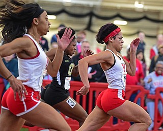 YOUNGSTOWN, OHIO - FEBRUARY 28, 2016: Nina Grambling of YSU sprints to the finish line ahead of Kendell Jefferson of Oakland and Taylor Tompkins of Youngstown State during the women's 60 meter dash final Sunday afternoon during the Horizon League Championship meet at the Watts Training Facility. DAVID DERMER | THE VINDICATOR
