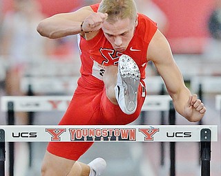 Jeff Lange | The Vindicator  SUN, FEB 28, 2016 - Youngstown State University's Chad Zallow jumps a hurdle during the men's 60 meter hurdles at Sunday's Horizon League Indoor Track Championship in Youngstown. Zallow claimed first place with a time of 7.84 seconds.