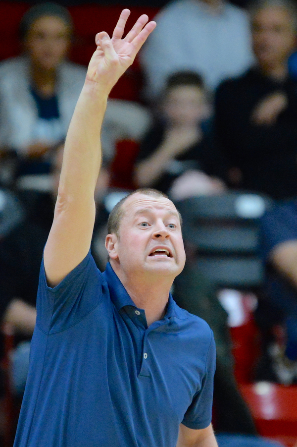 Jeff Lange | The Vindicator  MON, FEB 29, 2016 - McDonald head coach Jeff Rasile calls out a play from the sideline of Monday's district semifinal game against Lowellville in Struthers.